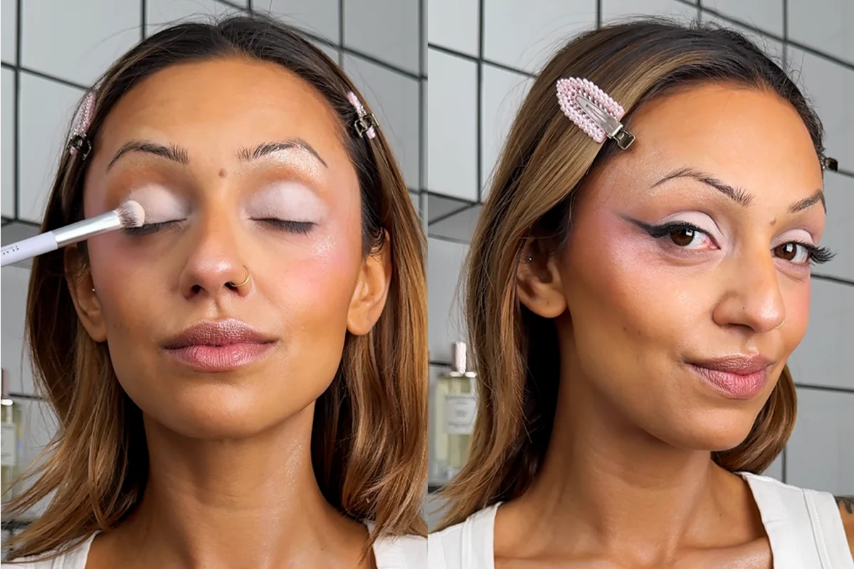 En tutorial som viser steg for steg hvordan man sminker seg til Glinda. Bildet viser en person med mørkt hår og en hvit topp, som bruker en hvit applikator for å påføre sminke fra en annen vinkel. Personen har rosa hårklemmer og står mot en bakgrunn med hvite og svarte fliser.