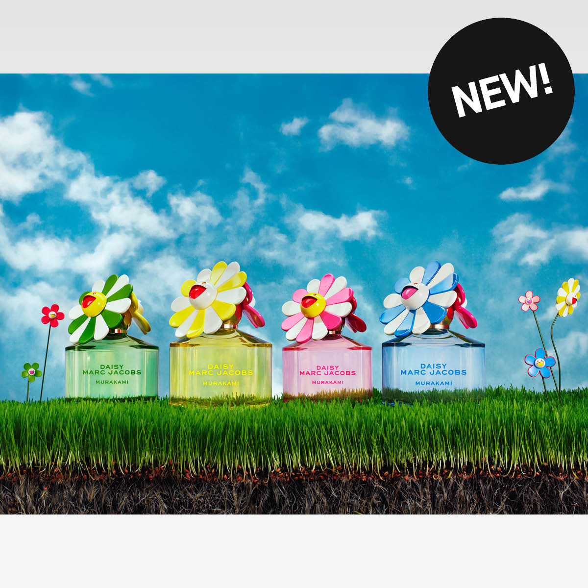 Fire fargerike Daisy Marc Jacobs Murakami-parfymeflasker med blomsterlokk, med teksten NEW!