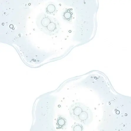 Närbild på genomskinlig gel- eller serumtextur med små bubblor