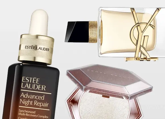 Estée Lauder Advanced Night Repair serum med pipettflaska visas tillsammans med en YSL-parfymflaska med guldfärgad YSL-logotyp och en öppen Fenty Beauty highlighter i skimrande nyans.