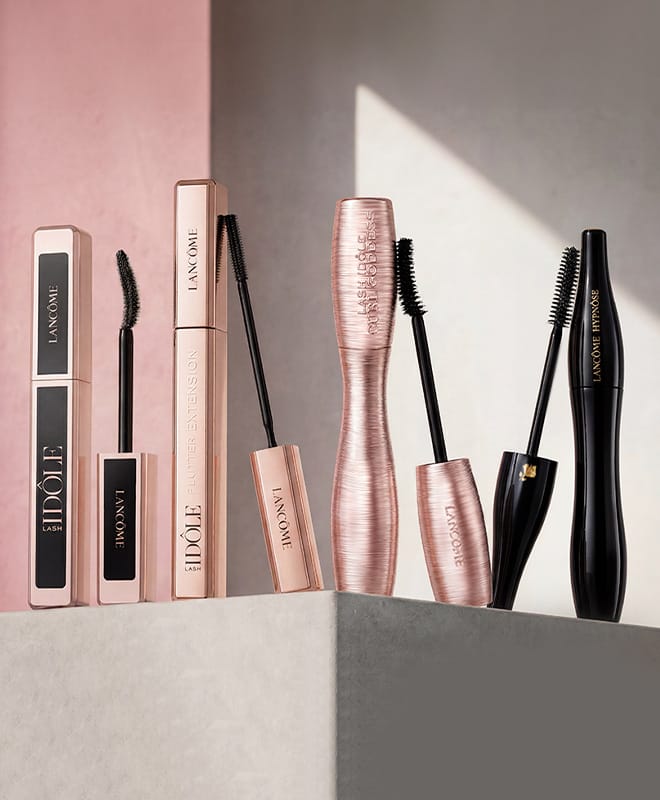 Fyra mascaror från Lancôme med olika mascaraborstar mot en ljus bakgrund.